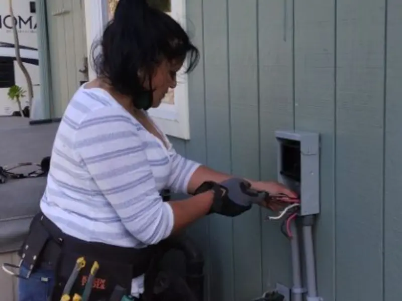 Licensed electrician wiring an exterior subpanel in Ben Lomond